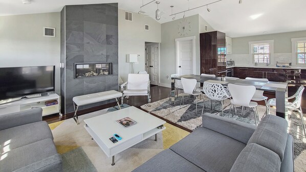 Comfortable seating, large flat screen TV and gas fireplace in living room
