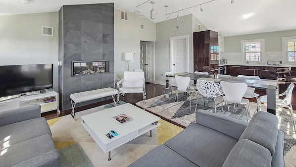 Comfortable seating, large flat screen TV and gas fireplace in living room
