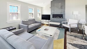 Comfortable seating, large flat screen TV and gas fireplace in living room