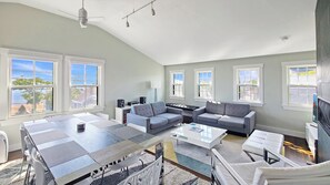 Main living area is open and bright, views of Commercial Street and Provincetown Harbor from front windowns