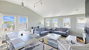 Main living area is open and bright, views of Commercial Street and Provincetown Harbor from front windowns
