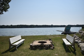 Lower level....Family room walkout to firepit area right @ the beach on Fox Lake