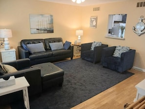 The blue leather sofa offers a queen bed to accommodate 6 if needed.