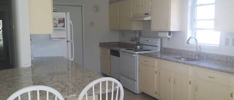 new granite counter tops in kitchen. 