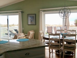 Kitchen and dining area also overlook the ocean. You won’t mind cooking.