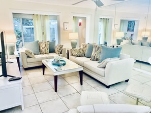 Very comfortable living room with a 65 in TV.
