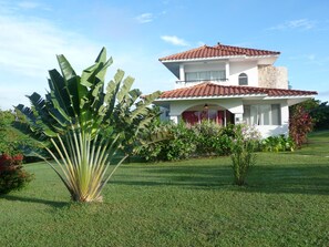 This is your vacation casa on a tropical lot.