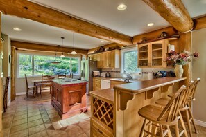 Open kitchen, 3 eating areas, no one misses the action!  Three seated bar area.