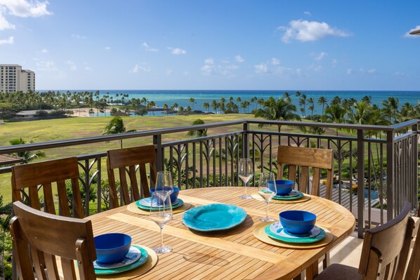 East facing lanai dining on teak and overlooking resort and ocean