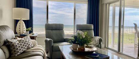 Living Area with Direct Ocean View. There are two leather recliner swivel chairs