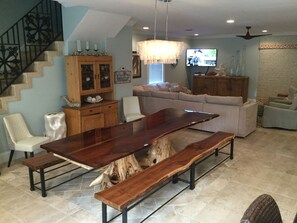Exquisite table with bench seating for 12 and 2 additional chairs.
