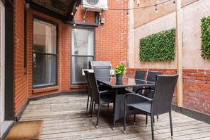 Nice private patio with outdoor furniture and BBQ