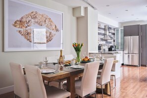 Inviting dining area next to the kitchen, view on the terrace