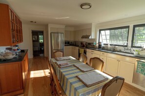 Newly renovated kitchen (20' x 13') view towards main house entry back left door