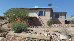 Rear view of house w/deck overlooks water