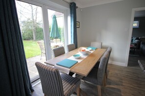 Dining area. Seating for 6.  French doors to garden & garden furniture.