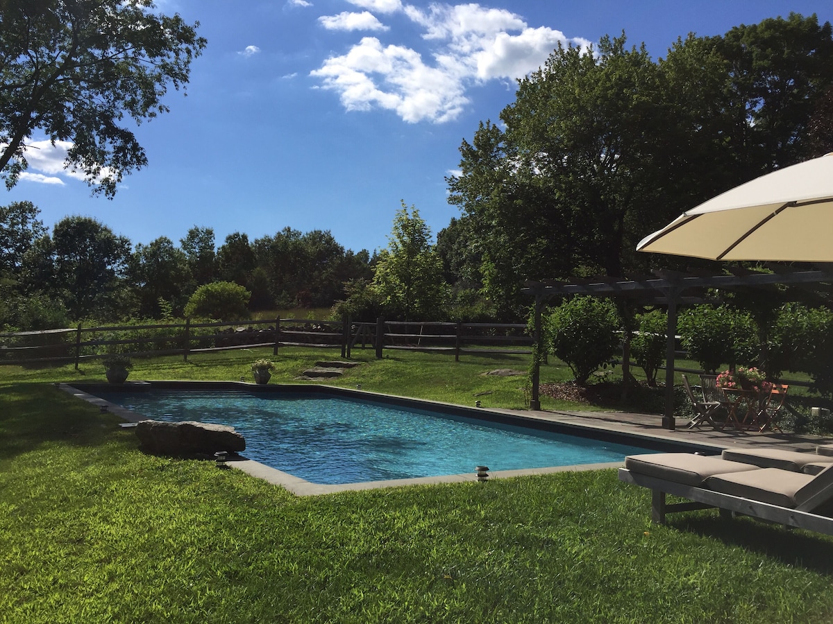 Super comfy, chic converted barn with saltwater pool on 6 acres.