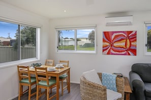 Dining area and lounge.  Split system air con/heating and blinds on all windows