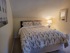 Second floor queen bedroom with open access to balcony over living area