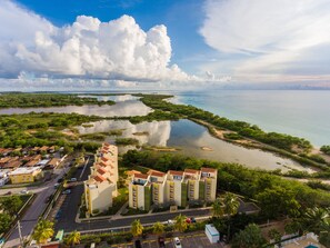 Aerial view of Vistamar Condominium with Combate beach on the right.