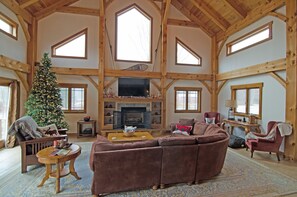 Vaulted ceiling in great room, gas fireplace and flat screen TV with DirectTV
