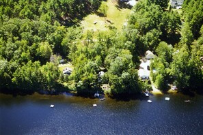 Aerial View- Cottage is in center of photo, boats at dock