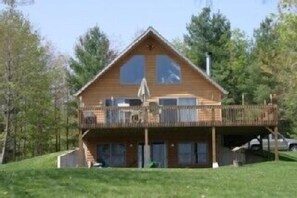 Front of house faces lake.  Beach and pier are right in front.