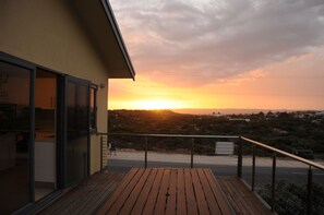 Front upper deck with dining table and bbq facilities