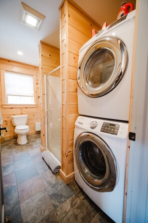 Main floor bathroom with washer and dryer
