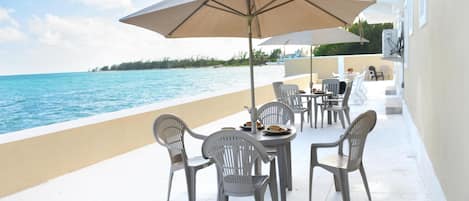 Bask on our patio at Waterfront Haven! Eat, Lounge, Fish!