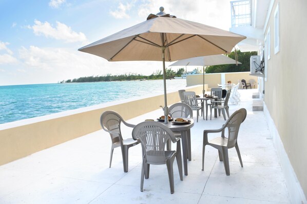 Bask on our patio at Waterfront Haven! Eat, Lounge, Fish!
