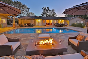 Pool Terrace at night by the firepit