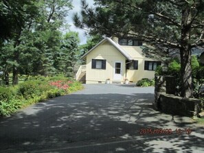 Front of the house, seen as you arrive. Paved parking for 5 average-size cars.