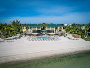 Close up aerial view of the heated pool and beachfront