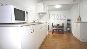 Fully equipped kitchen with oven, cook top and microwave