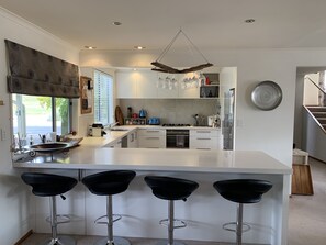 Modern well appointed kitchen with breakfast bar