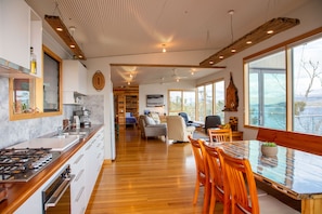 Open plan living, facing north west towards the beach 