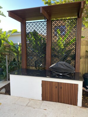 BBQ Bench & Weber BBQ
Light switch in pool equipment cupboard on LHS of  Bench