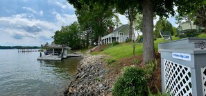 Waterfront view of dock, home, and Fox deck 2...185 feet of shoreline.