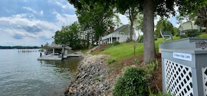 Waterfront view of dock, home, and Fox deck 2...185 feet of shoreline.