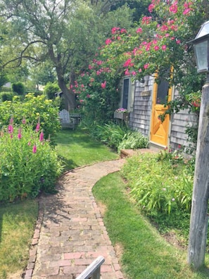 walkway to "Barque" with view of perennial gardens