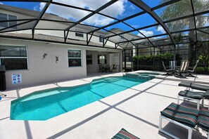 Enjoy eating under the lanai with overhead fan for your comfort.