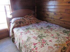 Middle bedroom has a queen size bed 