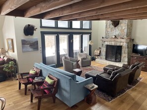 Spacious open living room with custom designed fireplace.