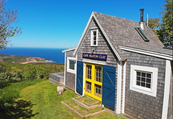 classic oceanside cottage with stunning views over ocean, beach and island.