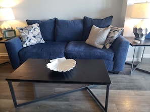 Living room with couch, love seat and two chairs 2023.