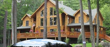 Stunning 16 Acre Estate with spacious Log Home and Private Pond!