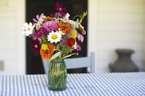 A small table on the porch provides a place for lunch or nibbles