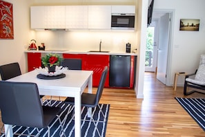 Modern kitchen to include dishwasher, microwave and coffee machine.