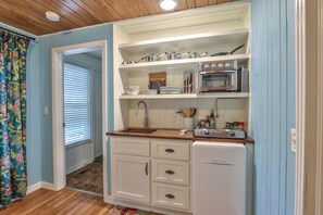 Kitchen equipped with convection oven/air fryer & stove top burners.